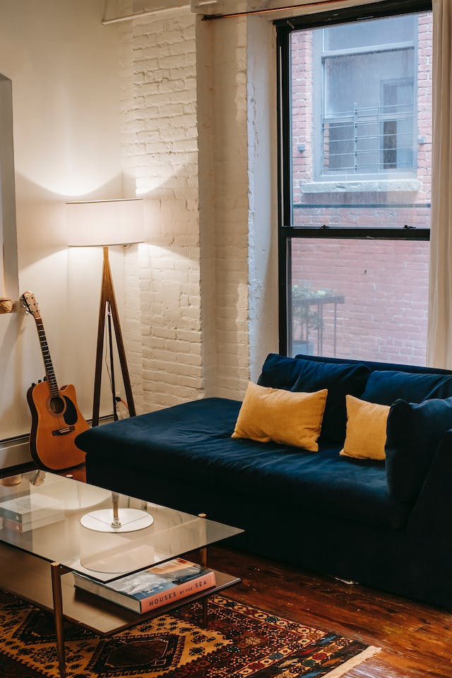 double-hung-windows-a-sofa-and-a-guitar